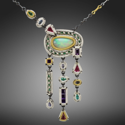 Jack Boglioli art jewelry necklace made with sterling silver and 24k gold. Opal, tourmaline, tanzanite, emerald, amethyst and apatite.