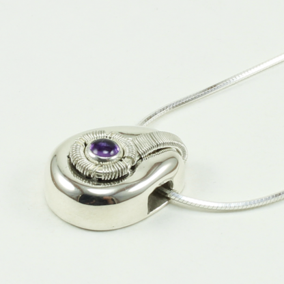 Angleshot of small Jack Boglioli pendant from the Boldly Unique Collection with amethyst