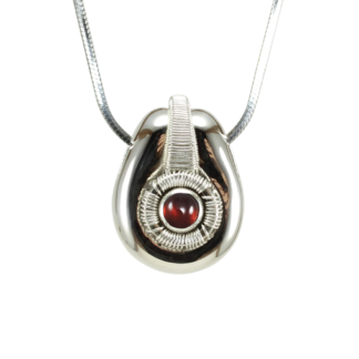 Small Jack Boglioli pendant from the Boldly Unique Collection with garnet