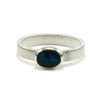 Direct shot of Jack Boglioli bound band ring with blue paua shell