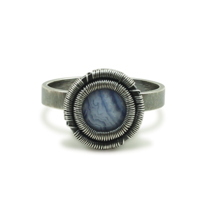 Direct shot of Blue lace agate ring by Jack Boglioli with slight patina and signature "Boglioli Setting"