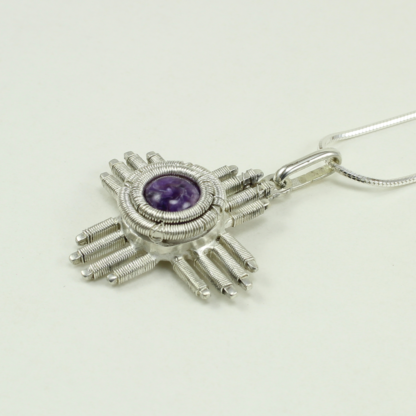 Angle shot of medium Jack Boglioli Zia pendant from the New Mexico Collection with charoite
