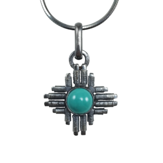 Small Jack Boglioli Zia pendant from the New Mexico Collection with turquoise and patina