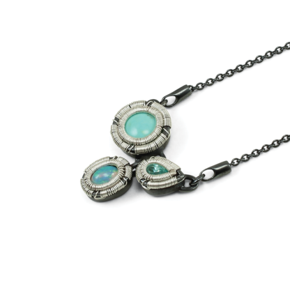Angle shot of Jack Boglioli pendant from the Opulence collection with turquoise, apatite and opal