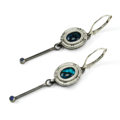 Angle shot of Jack Boglioli blue Paua shell and sapphire earrings